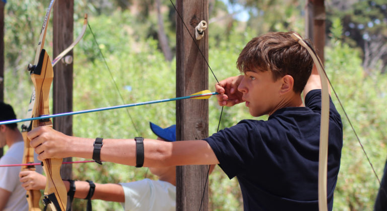 archer taking aim at a target