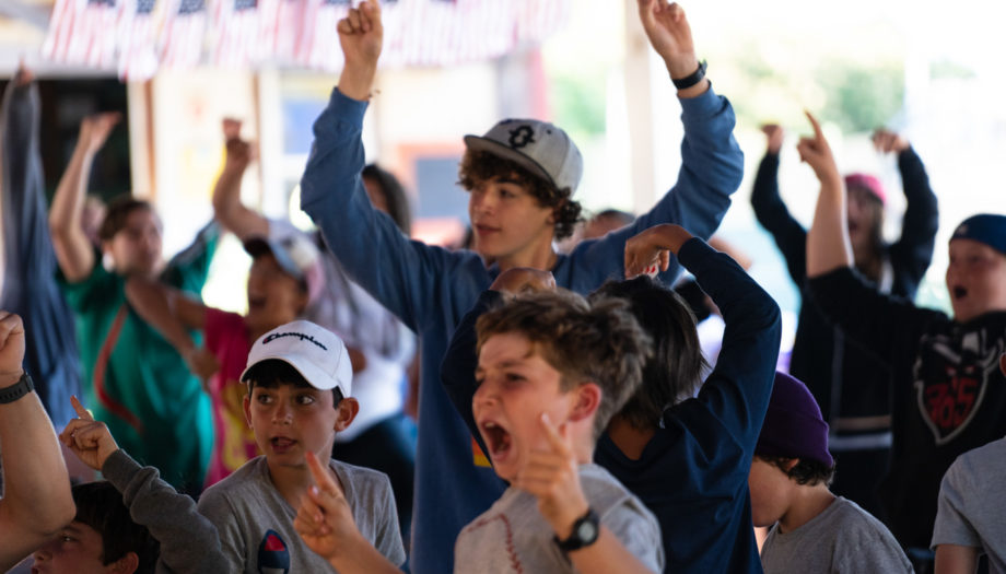 Kids celebrating an announcement at lunch